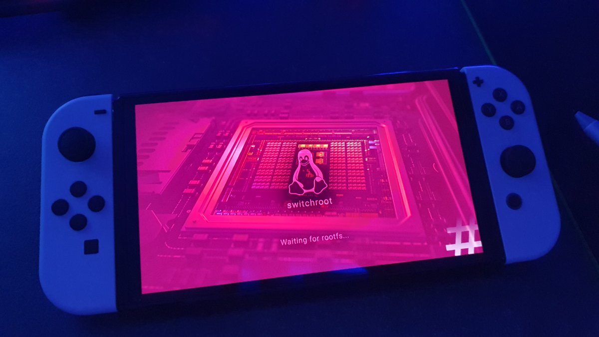 switchroot booting Linux on the Switch — the penguin splash, waiting for rootfs.